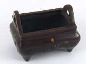 Appraisal: A cast bronze rectangular censer on four stub feet cast