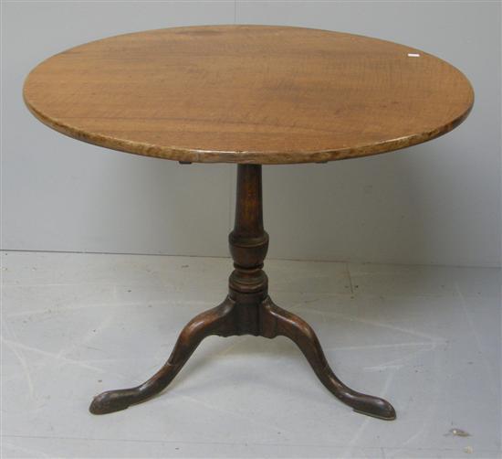 Appraisal: George III oak tilt top table on turned column and