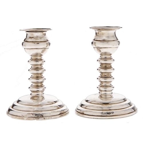 Appraisal: A pair of Victorian silver dwarf candlesticks with spool knopped