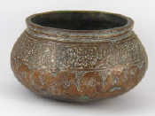 Appraisal: An antique Syrian copper bowl with thickened rim and traces