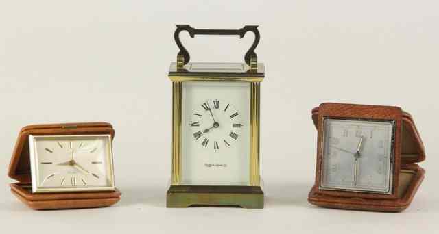 Appraisal: A gilt brass cased carriage clock the white enamel dial