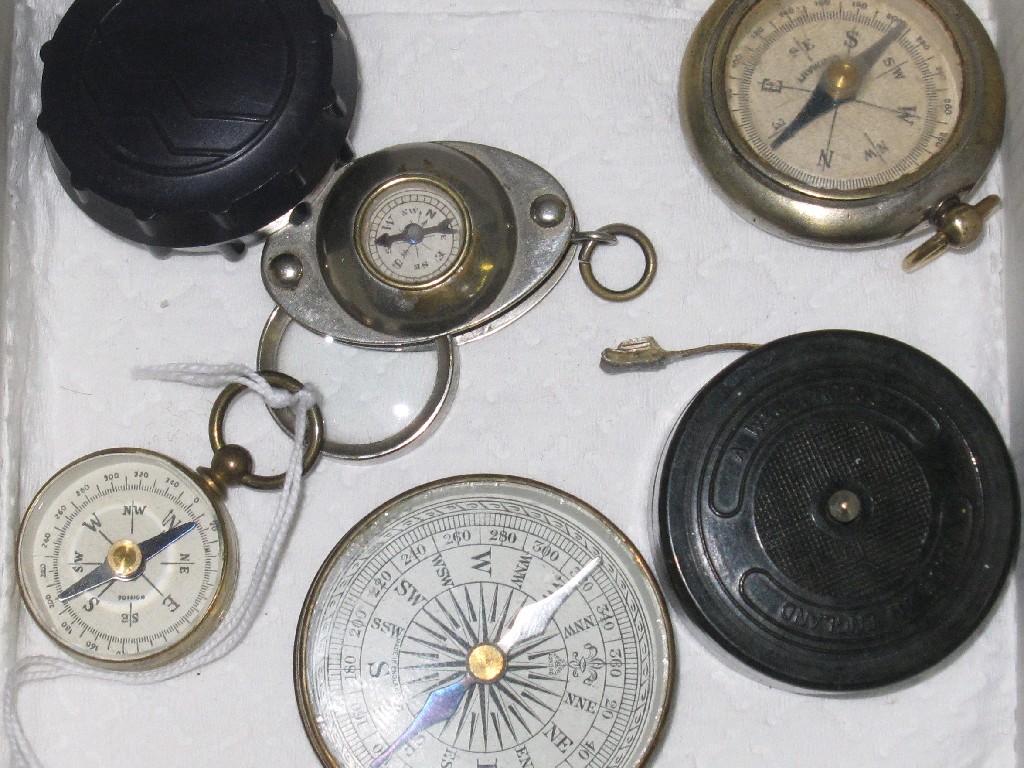 Appraisal: Lot comprising five pocket compasses and a measuring tape