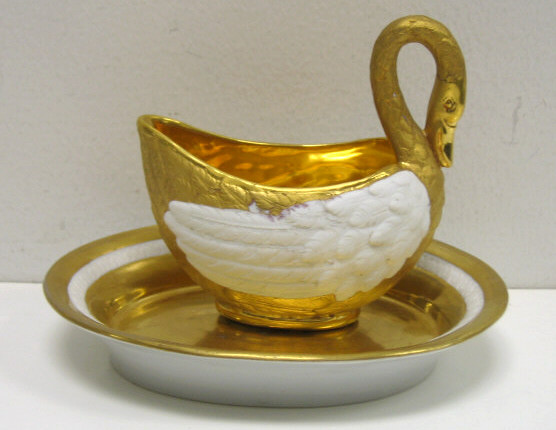 Appraisal: SEVRES SAUCE BOAT AND UNDERPLATE Gilt Parian porcelain swan-shaped dish