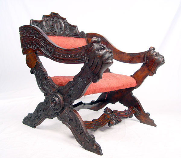 Appraisal: LOW CARVED MAHOGANY SAVONAROLA CHAIR Ornate acanthus leaf carving to