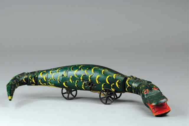 Appraisal: WOODEN CLOCKWORK ALLIGATOR TOY Probably German hand painted in green