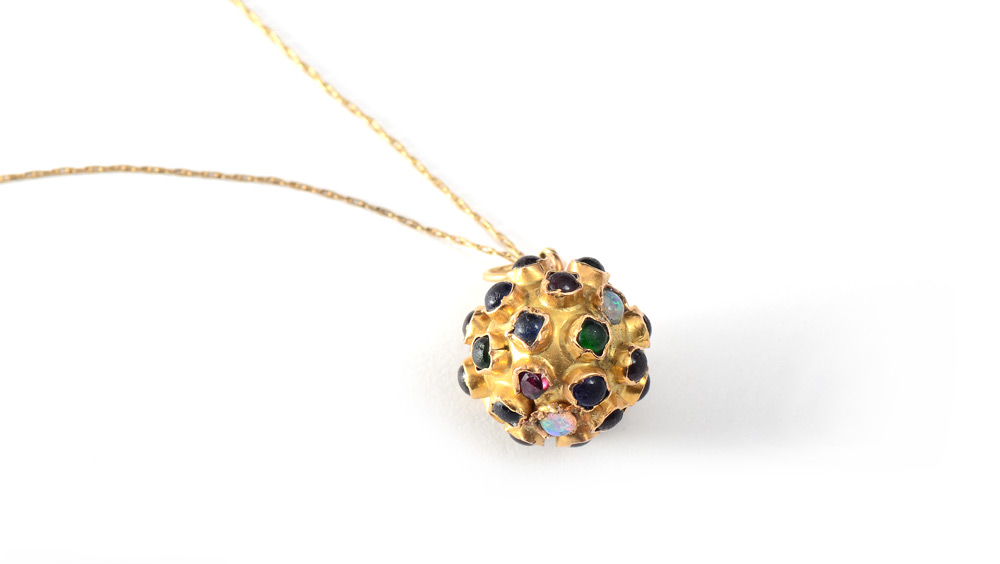 Appraisal: GOLD MULTI STONE SPUTNIK NECKLACE K yellow gold pendant on