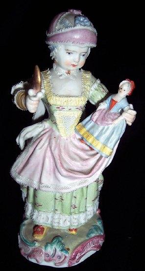 Appraisal: A th Century Meissen figure of a girl a rattle