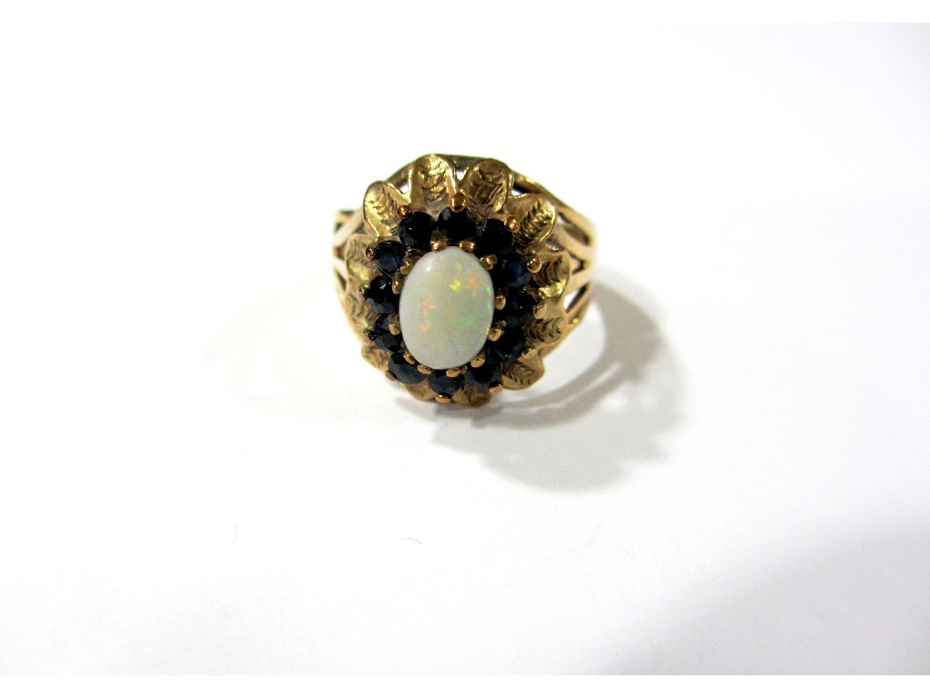 Appraisal: A ct gold opal and sapphire cluster dress ring of