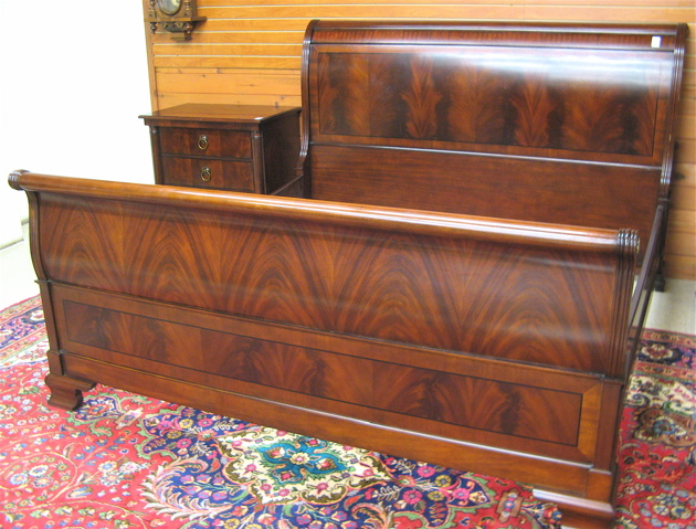 Appraisal: FOUR-PIECE EMPIRE STYLE MAHOGANY BEDROOM SET comprising king sleigh bed