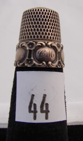 Appraisal: Simons sterling thimble with oval designs on band engraved CM