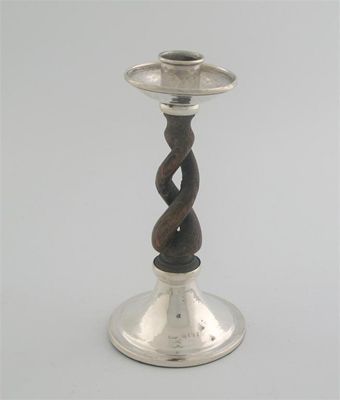 Appraisal: By A E Jones a modern mounted oak candlestick with