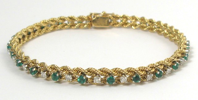 Appraisal: EMERALD DIAMOND AND YELLOW GOLD BRACELET The k gold bracelet