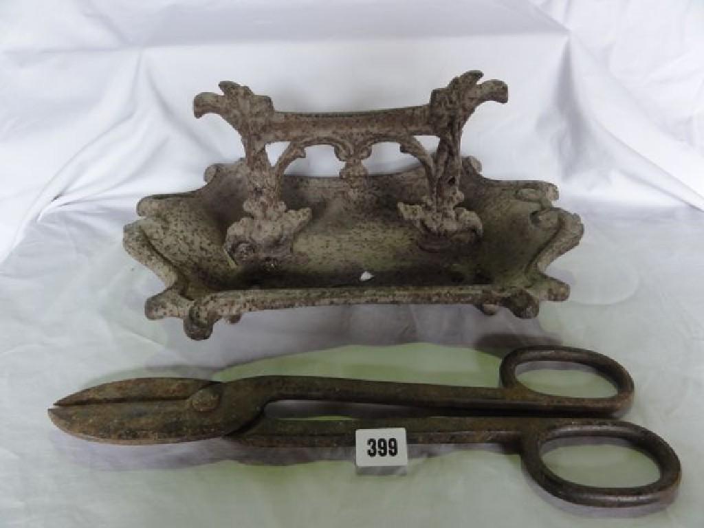 Appraisal: An early th century cast iron foot scraper with shaped