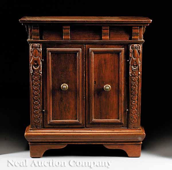 Appraisal: An Italian Baroque Walnut Cupboard th c with restorations molded