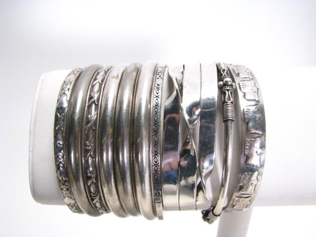 Appraisal: Ten sterling silver bracelets most are bangles two are adjustable