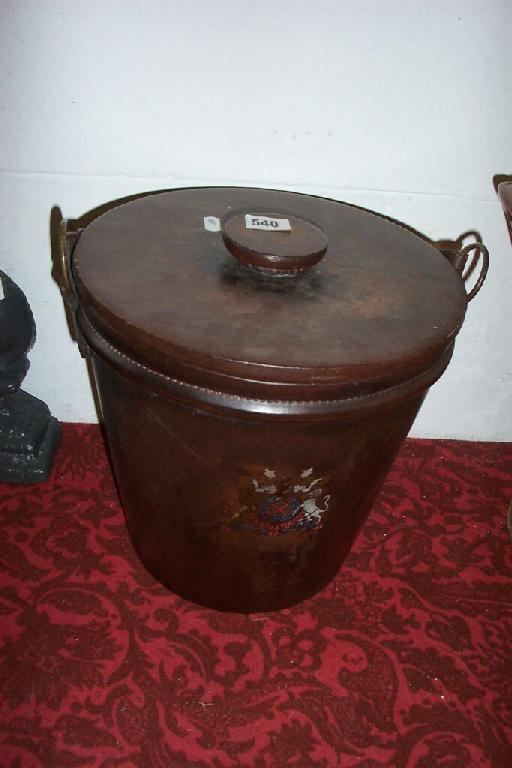 Appraisal: A leather mounted coal box and cover with brass ring