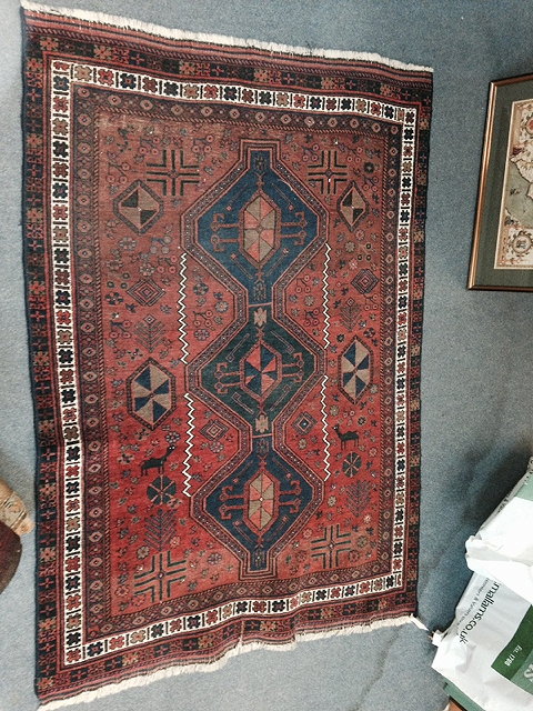 Appraisal: AN OLD PERSIAN AFSHAR RUG with central interlinked blue medallions