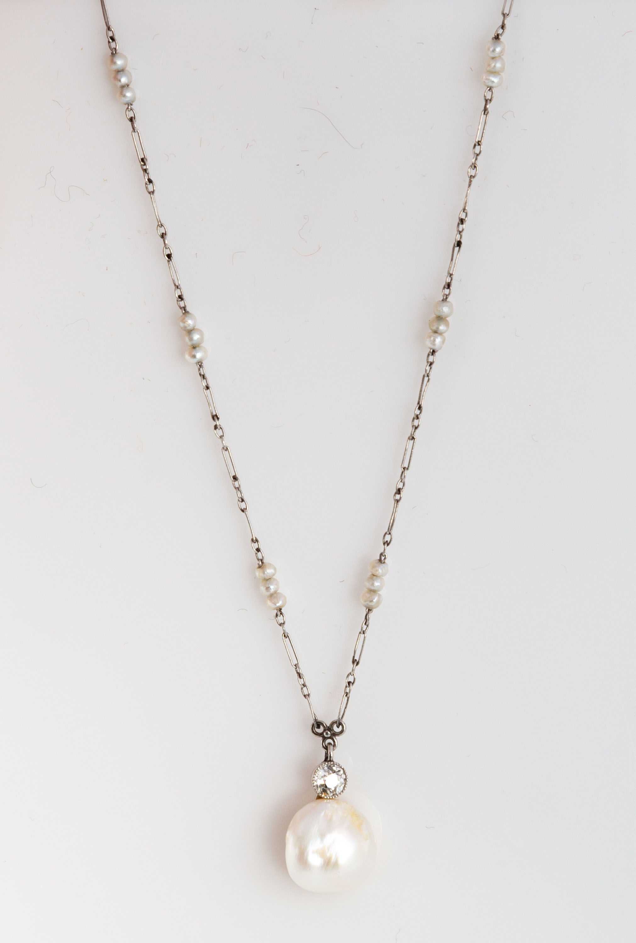 Appraisal: PLATINUM NATURAL PEARL AND DIAMOND NECKLACE grams