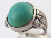 Appraisal: A white metal tests carat gold turquoise and diamond ring