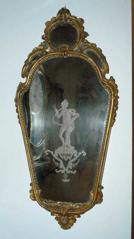 Appraisal: CARVED GILTWOOD MIRROR Baroque Italy circa With finely engraved mirror