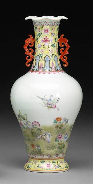 Appraisal: A yellow ground famille rose enameled porcelain baluster vase Qianlong