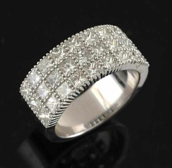 Appraisal: A diamond dress ring The wide band set with three