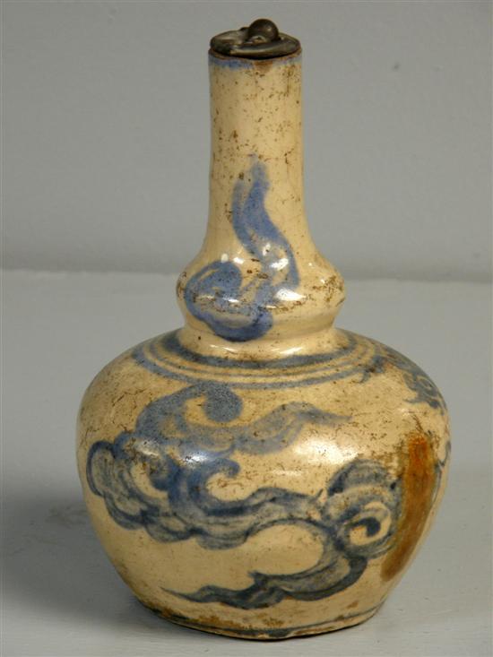 Appraisal: Chinese pottery bottle vase painted in blue with scrolling cloud