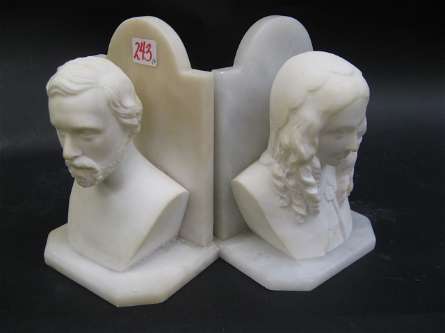 Appraisal: PAIR WHITE MARBLE SCULPTED BOOKENDS c 's male and female