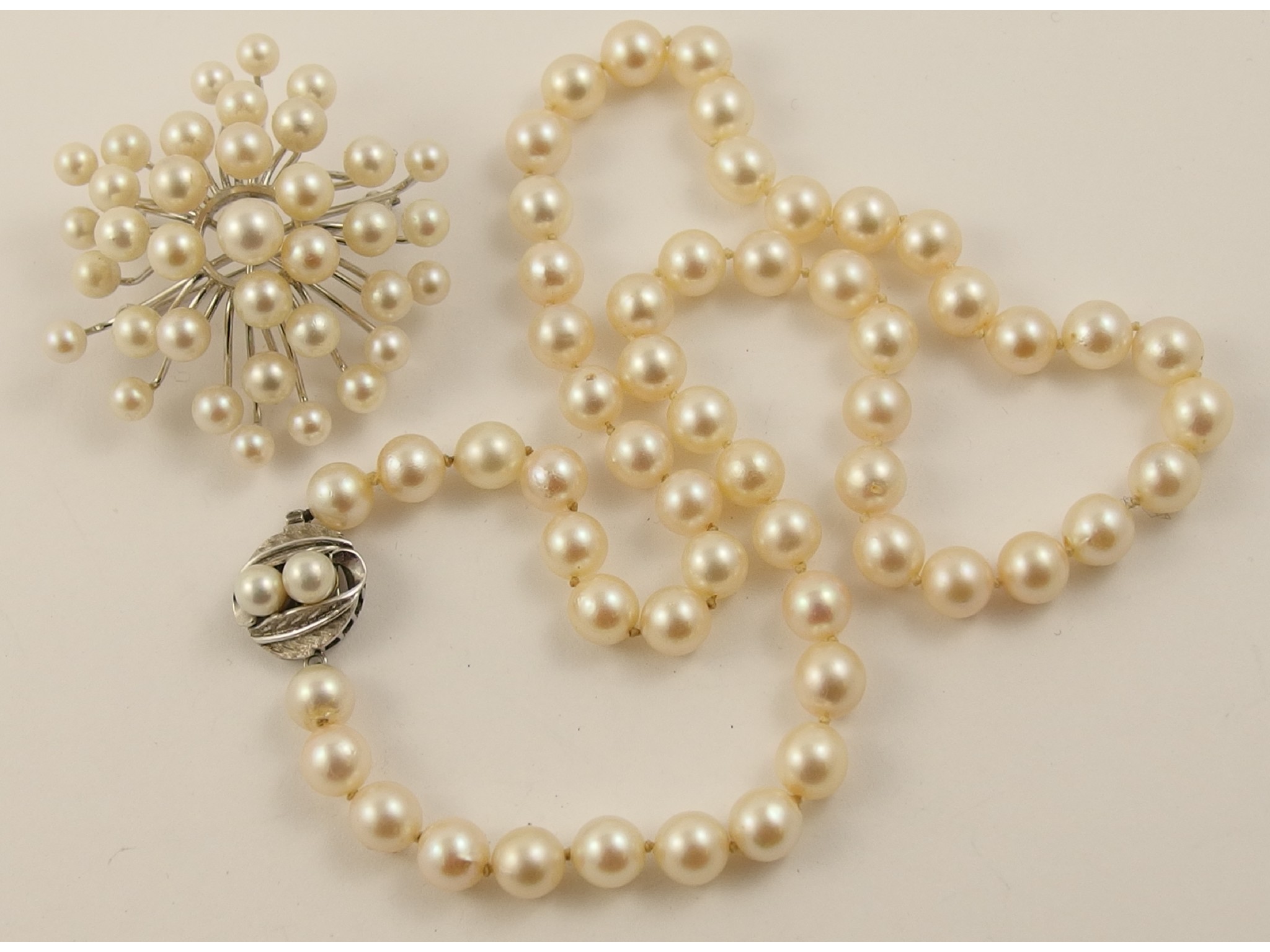 Appraisal: A string of Mikimoto pearls with ct clasp and a