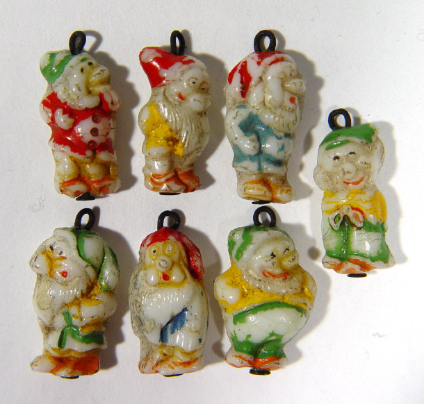 Appraisal: Seven miniature Snow White Dwarf hanging decorations each cm high