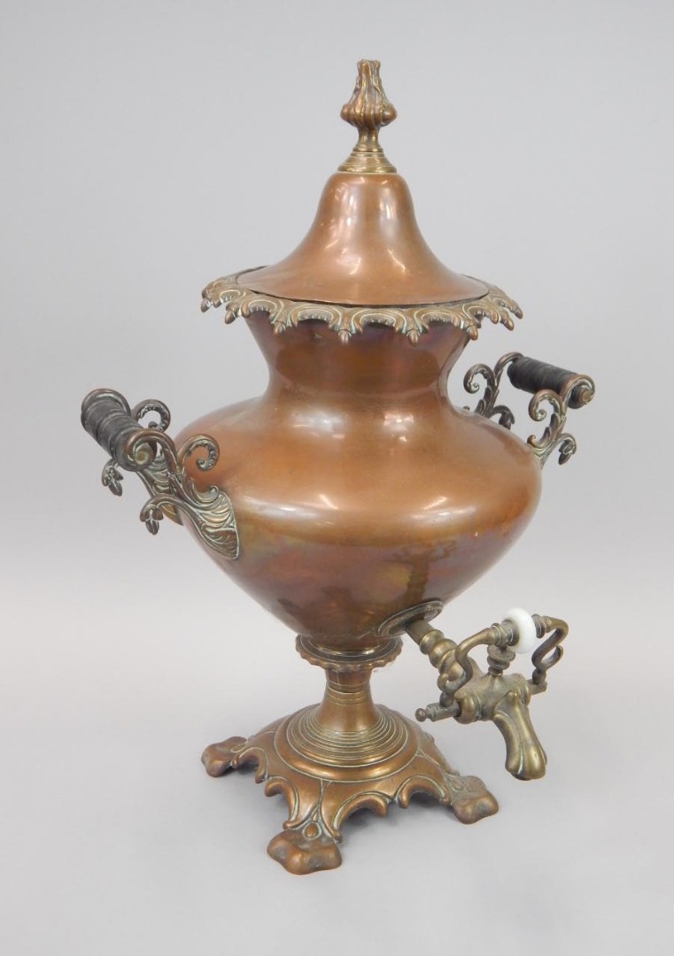 Appraisal: A Victorian copper and brass two handled samovar with flamed