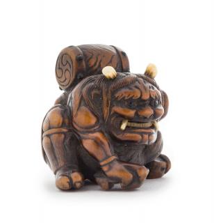 Appraisal: A Carved Boxwood Netsuke A Carved Boxwood Netsuke depicting an