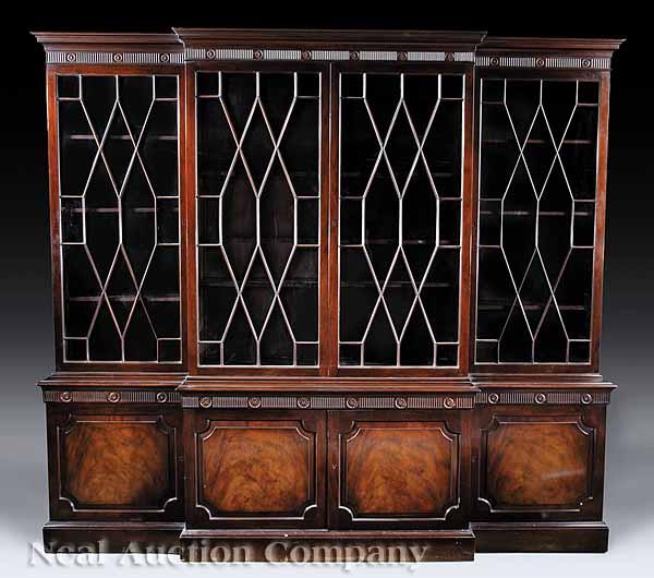 Appraisal: A Georgian-Style Mahogany Breakfront labeled Baker Furniture Co molded cornice