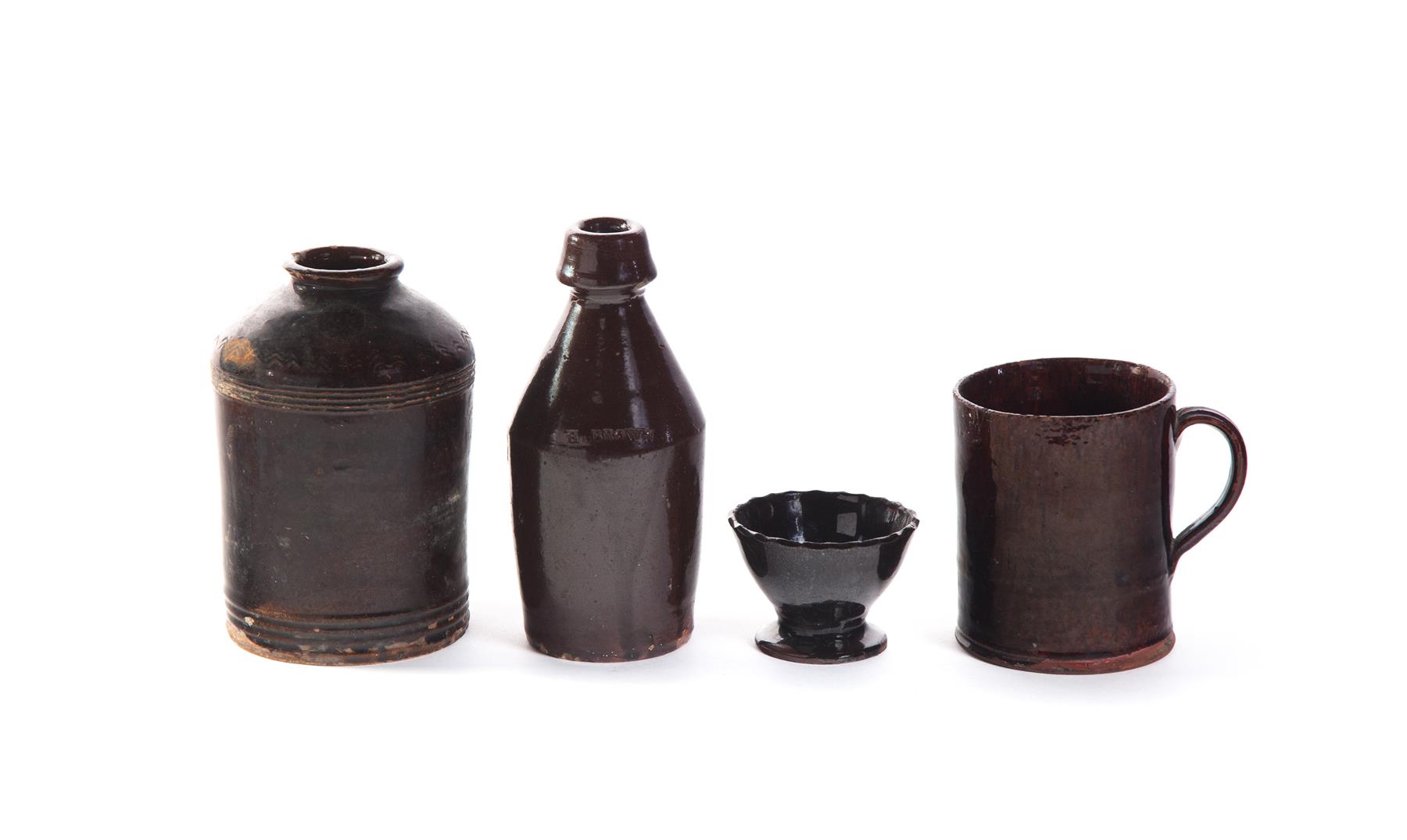 Appraisal: FOUR PIECES OF POTTERY WITH DARK BROWN GLAZE American st