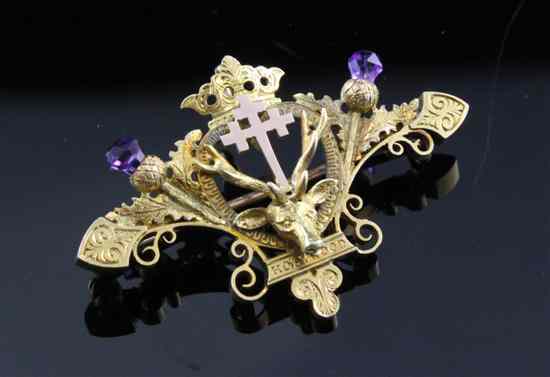 Appraisal: A late Victorian two colour gold and amethyst Holyrood brooch