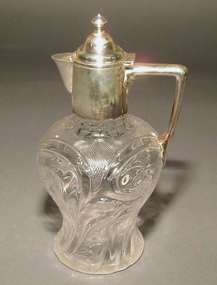 Appraisal: Claret jug with English silver top and handle and a