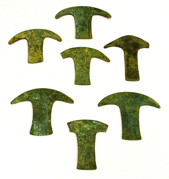 Appraisal: Seven ancient t-shaped metal fragments possibly currency some with broken