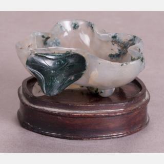 Appraisal: A Chinese Carved Agate Lotus Leaf Form Washer on a