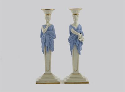 Appraisal: A pair of Royal Worcester candlesticks modelled as Classical terms