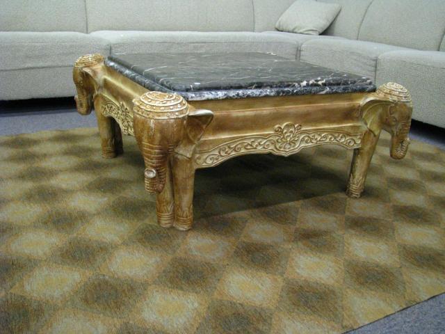 Appraisal: Elephant motif square marble top cocktail table molded composition base