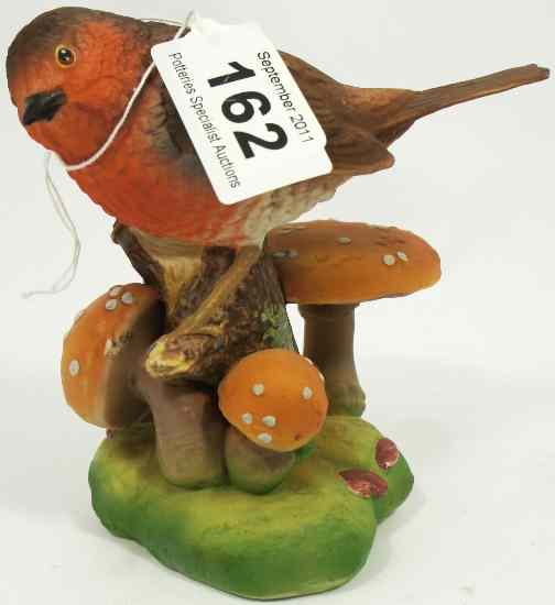 Appraisal: Wade Connoisseur Model of a Robin on Toadstool Base unmarked