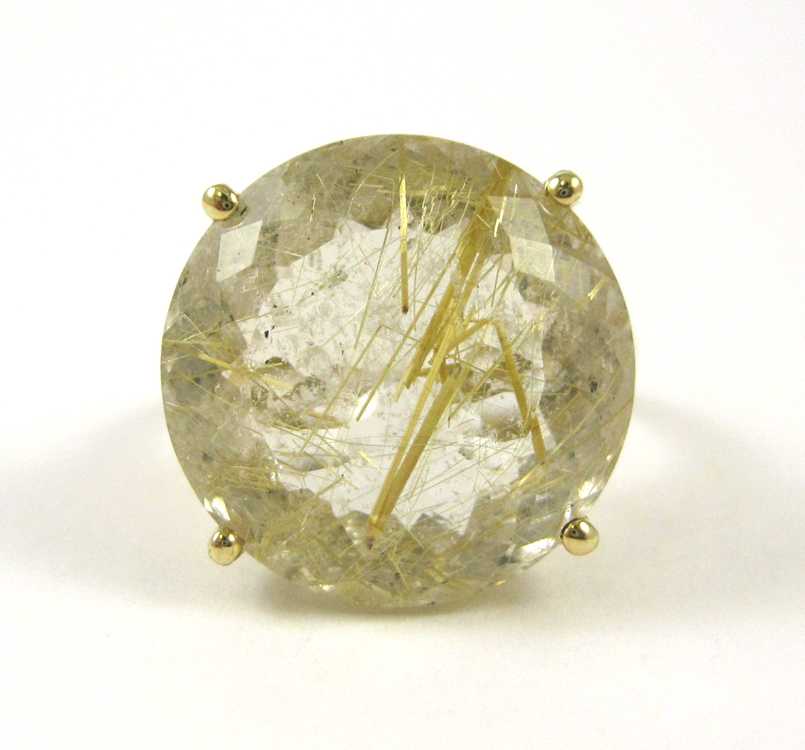 Appraisal: RUTILATED QUARTZ DIAMOND AND YELLOW GOLD RING The k gold