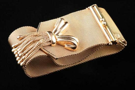 Appraisal: RETRO K YELLOW GOLD MESH BRACELET Accented with bow and