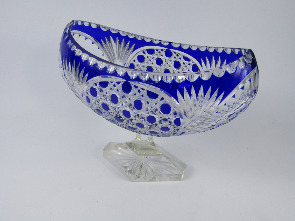 Appraisal: A Continental blue flashed glass pedestal fruit bowl the oval