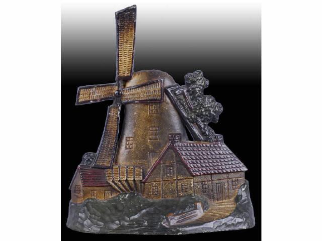 Appraisal: Large Cottage Cast Iron Doorstop Description Windmill with cottages on