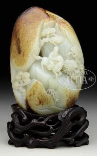 Appraisal: CARVED JADE BOULDER WITH RIDER th century China The boulder