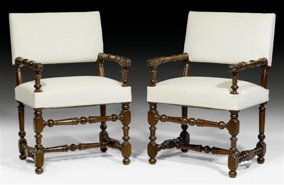 Appraisal: PAIR OF FAUTEUILS Louis XIII France circa Shaped walnut carved