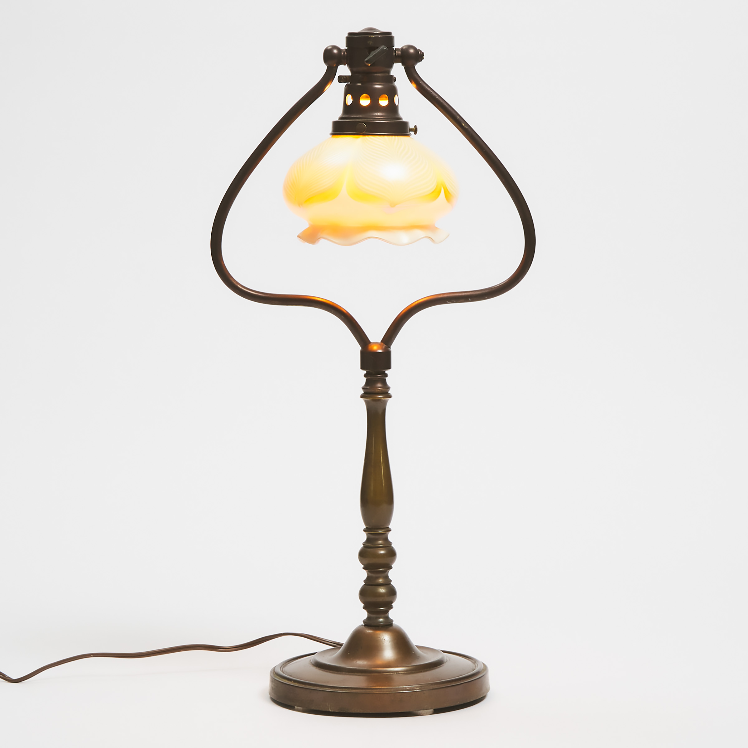 Appraisal: American Bronze Patinated Desk Lamp with Quezal Glass Shade c