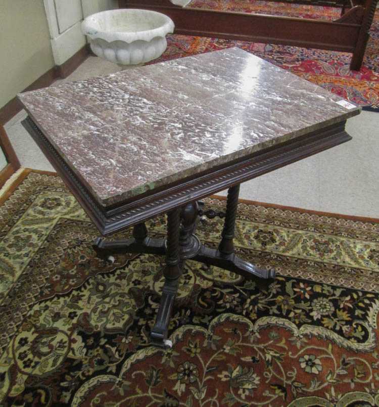 Appraisal: A VICTORIAN MARBLE-TOP WALNUT LAMP TABLE Eastlake style American c