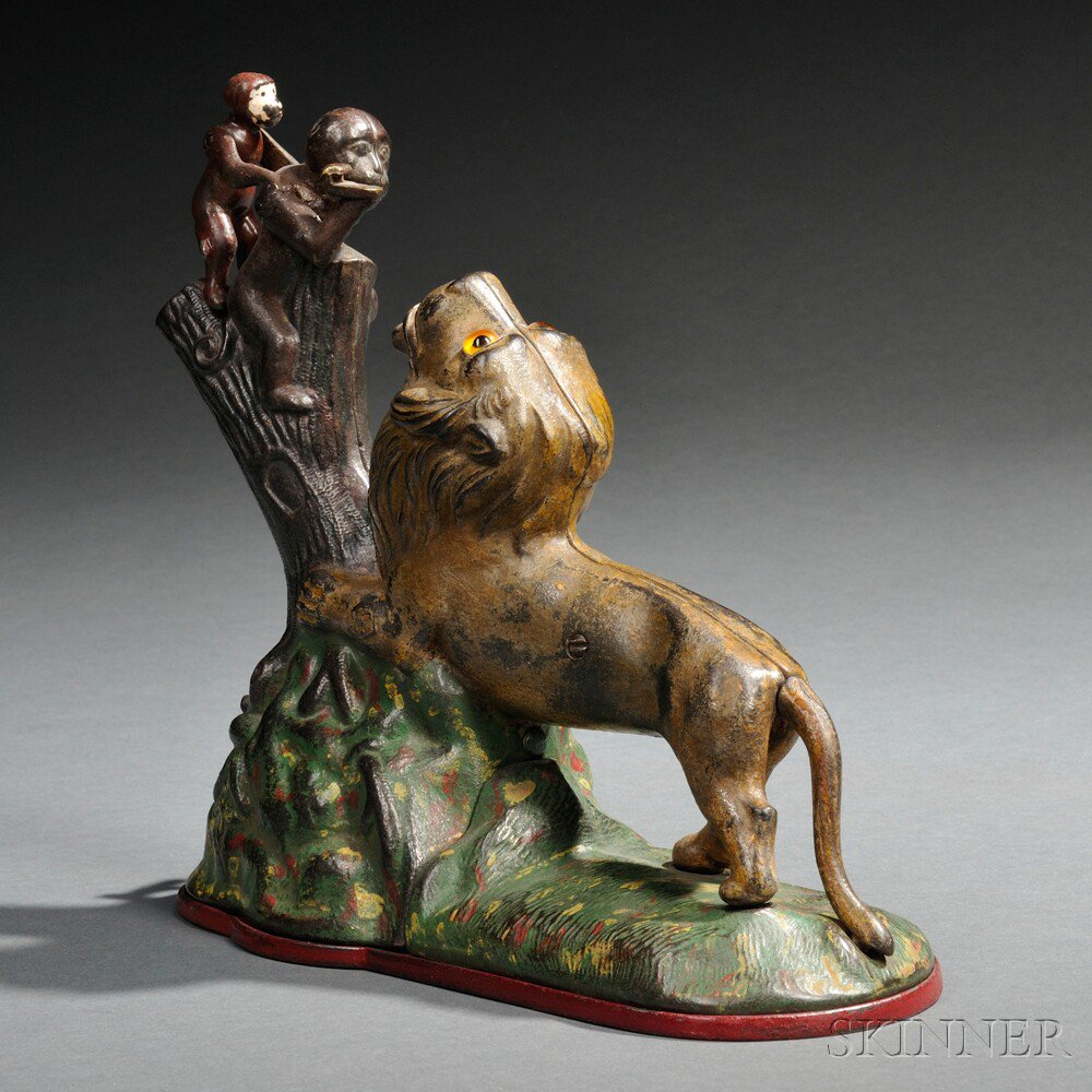 Appraisal: Painted Cast Iron Mechanical Lion and Two Monkeys Bank Kyser